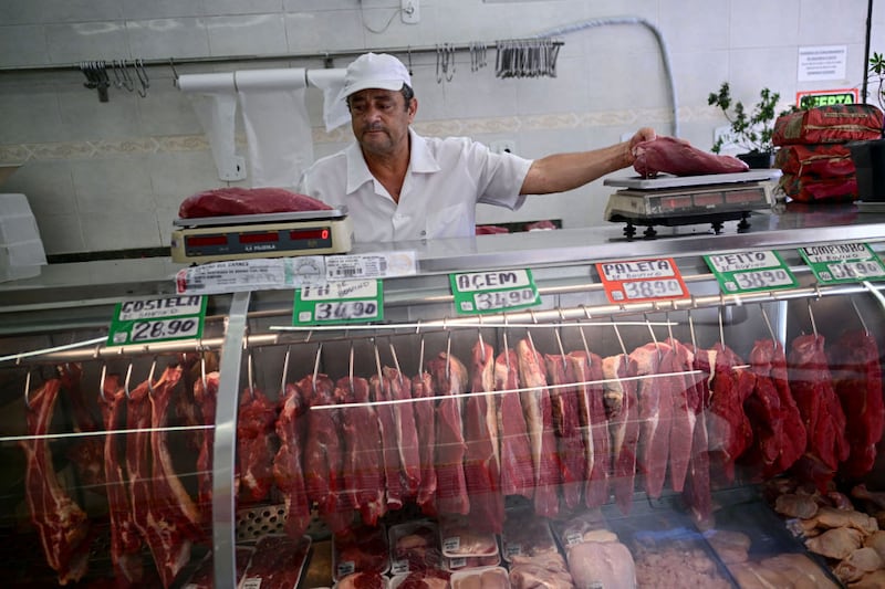 A butcher weighs meat at a butcher shop in Rio de Janeiro, Brazil. Under the agreement some 99,000 tonnes of beef could be sold into the EU from Mercosur countries each year. Photograph: AFP/Getty Images