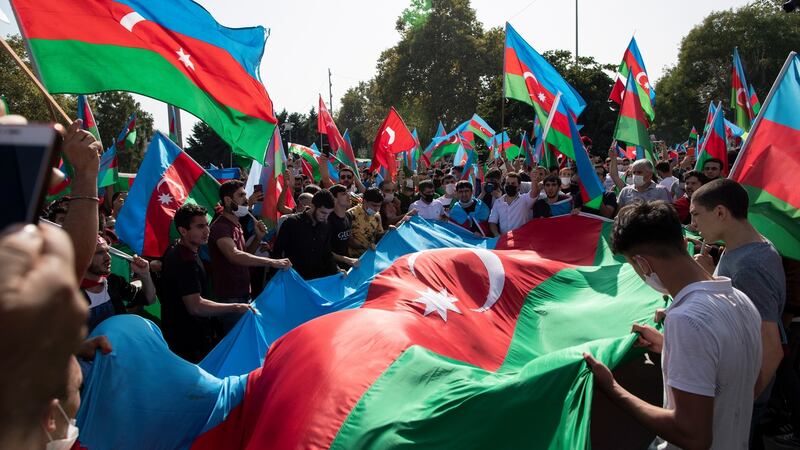 Protesters hold up a huge Azerbaijan flag as they shout slogans in a demonstration supporting Azerbaijan against Armenia, in Istanbul, Turkey, on Sunday. Photograph: Tolga Bozoglu/EPA