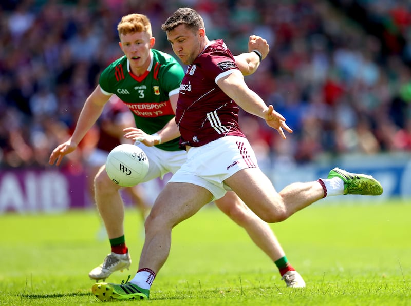 Mayo’s David McBrien and Damien Comer of Galway in the GAA Football All-Ireland Senior Championship Preliminary Quarter-Final at Pearse Stadium, Co Galway, last June. Photograph: ©INPHO/James Crombie