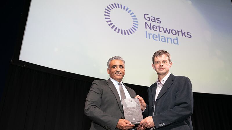 Sanjay Patel, Key Account Director at ISS Facility Services, presents Health & Safety Excellence Award - Public Sector award to Owen Wilson, Gas Networks Ireland.