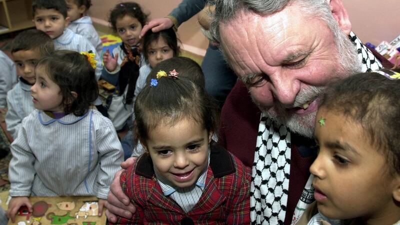 Terry Waite with Palestinian children during a visit to their school at the Beddawi refugee camp in the northern Lebanon in 2004