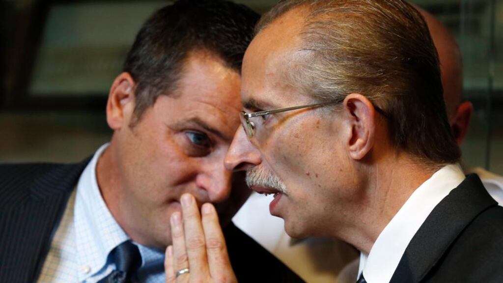 Hammond Mayor Thomas McDermott Jr (left) leans in to whisper to Hammond Police Lieutenant Richard Hoyda during a news conference about murders in Hammond, Indiana. Photograph: Reuters