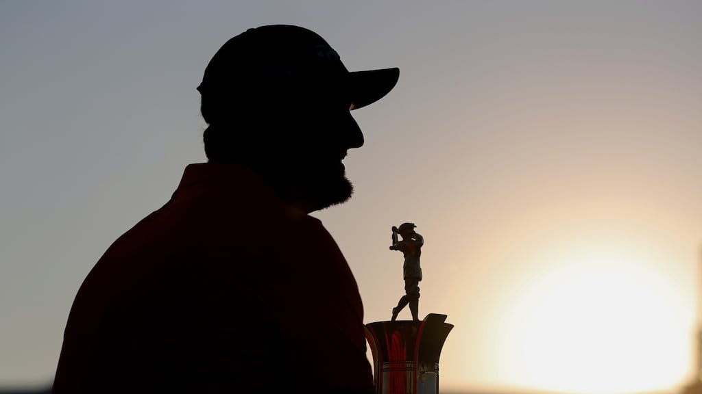 Spain’s Jon Rahm celebrates with the Race to Dubai Trophy after the final round of DP World Tour Championship at Jumeirah Golf Estates in Dubai. Photograph: Ali Haider/EPA
