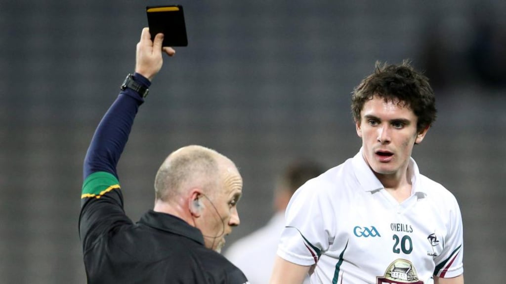 Referee Marty Duffy shows Kildare’s David Hyland a black card during Saturday’s league match with Dublin. Photograph: Inpho/Cathal Noonan