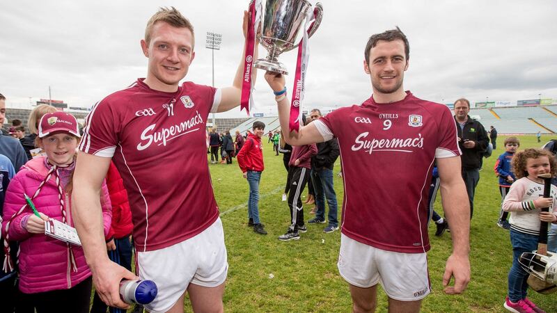 Galway’s Joe Canning and David Burke celebrate winning the Allianz League Division One trophy this year. Galway were the third team in a row to benefit from the more sedate surrounds of Division 1B. Photograph: Morgan Treacy/Inpho