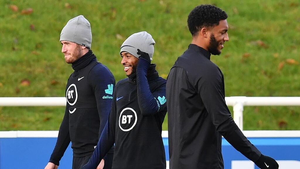England’s Ben Chilwell , Raheem Sterling and Joe Gomez during a training session at St George’s Park in Burton-on-Trent on Tuesday ahead of their Euro 2020 qualifier against Montenegro. Photograph: Paul Ellis/AFP via Getty Images