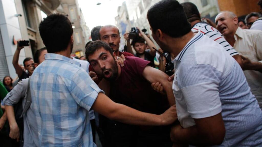 Plainclothes police officers detain a demonstrator (centre) during an anti-government protest on the main Istiklal Street in central Istanbul earlier this month. Photograph: Reuters