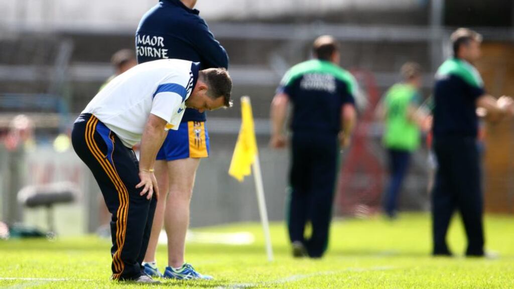 A dejected Clare manager Davy Fitzgerald during the defeat to Limerick. Photo: Cathal Noonan/Inpho