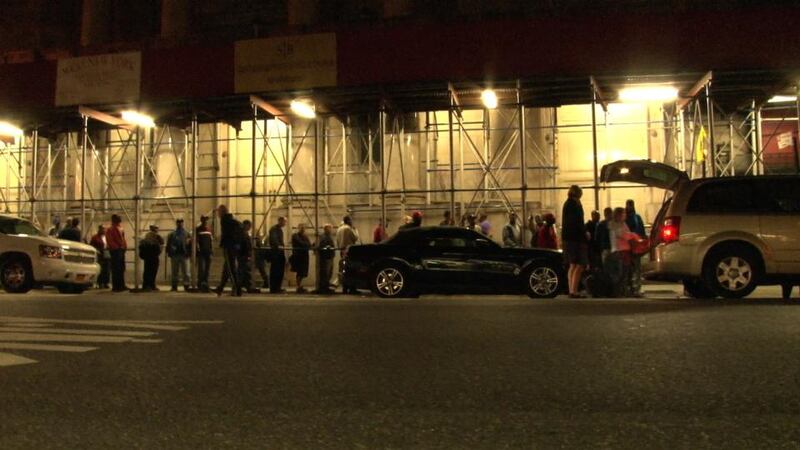Mercy mission: people queue in Manhattan to receive food from Irish Volunteers for the Homeless