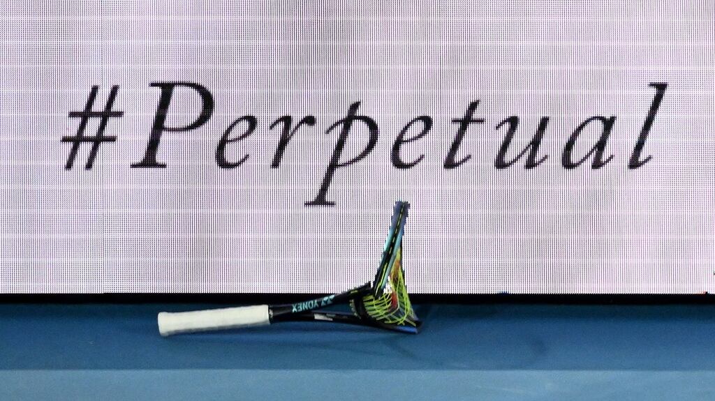 The broken racquet of Australia’s Nick Kyrgios is seen near an advertising sign following his loss in the second round against Russia’s Daniil Medvedev at the Australian Open. Photograph: Dave Hunt/EPA