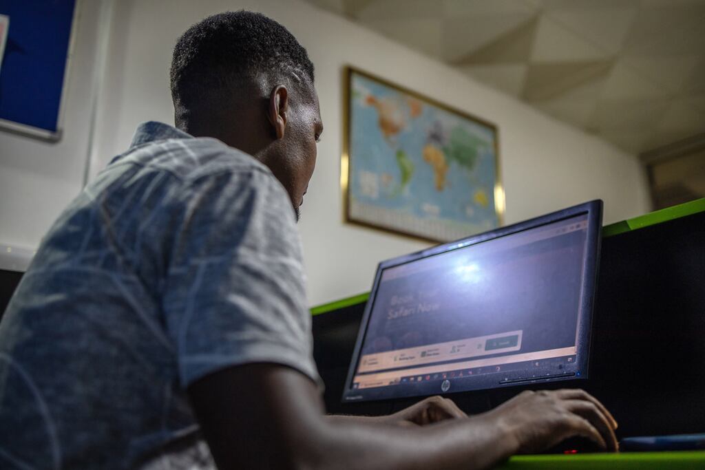 Simon Azarwagye, the owner of Azas Safaris, a Kampala-based travel company that has seen a sharp drop in bookings since Uganda’s parliament passed one of the harshest anti-LGBTQ laws in the world in May. Photograph: Stuart Tibaweswa/The New York Times