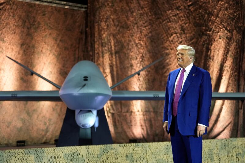 US president Donald Trump stands beside an MQ-9 Reaper drone at the Al Udeid Air Base in Doha, Qatar. Photograph: Alex Brandon/AP