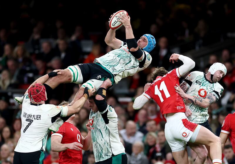 Tadhg Beirne of Ireland jumps for the ball with Ellis Mee of Wales. Photograph: Dan Istitene/Getty