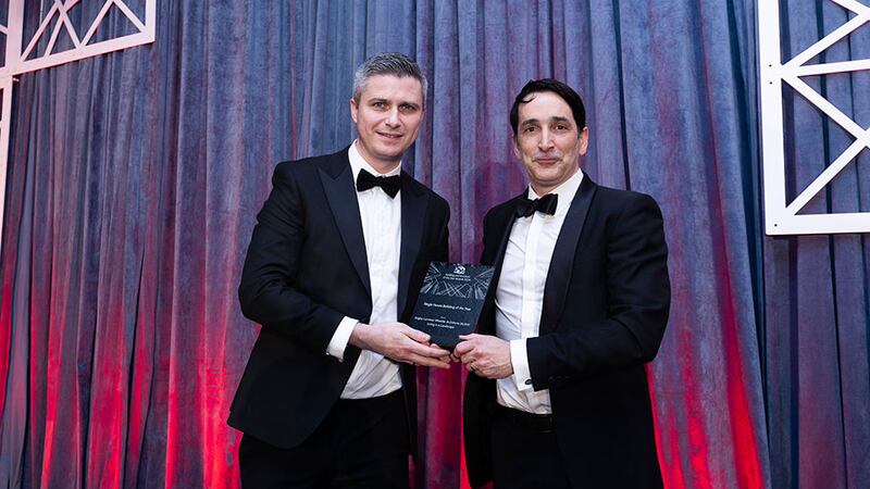 Derry Kearney, managing director Ireland & partner, Cundall, presents the single house building of the year to Mark Arigho, Arigho Larmour Wheeler Architects