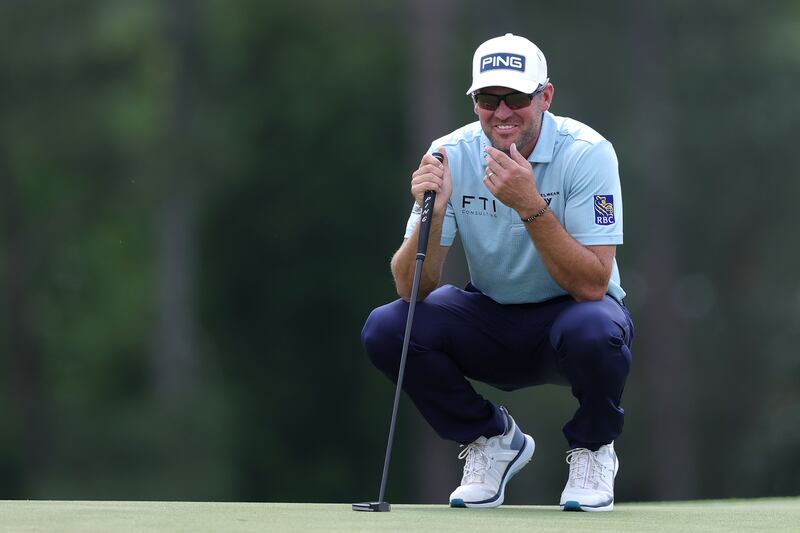 Corey Conners of Canada smiles on the 18th green. Photograph: Andrew Redington/Getty Images