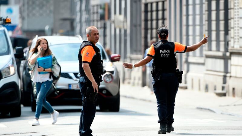 Police officers redirect traffic in the eastern Belgian city of Liege after an armed man killed two police officers. Photograph: AFP/Getty Images