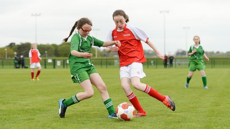 Alice Chambers, left, of Burrishoole Girls’ Football Club, Newport, Co Mayo, in action against Grace McIlvoy, from Clonbroney Girls’ Football Club, Co Longford, at the games. Photograph: Sportsfile