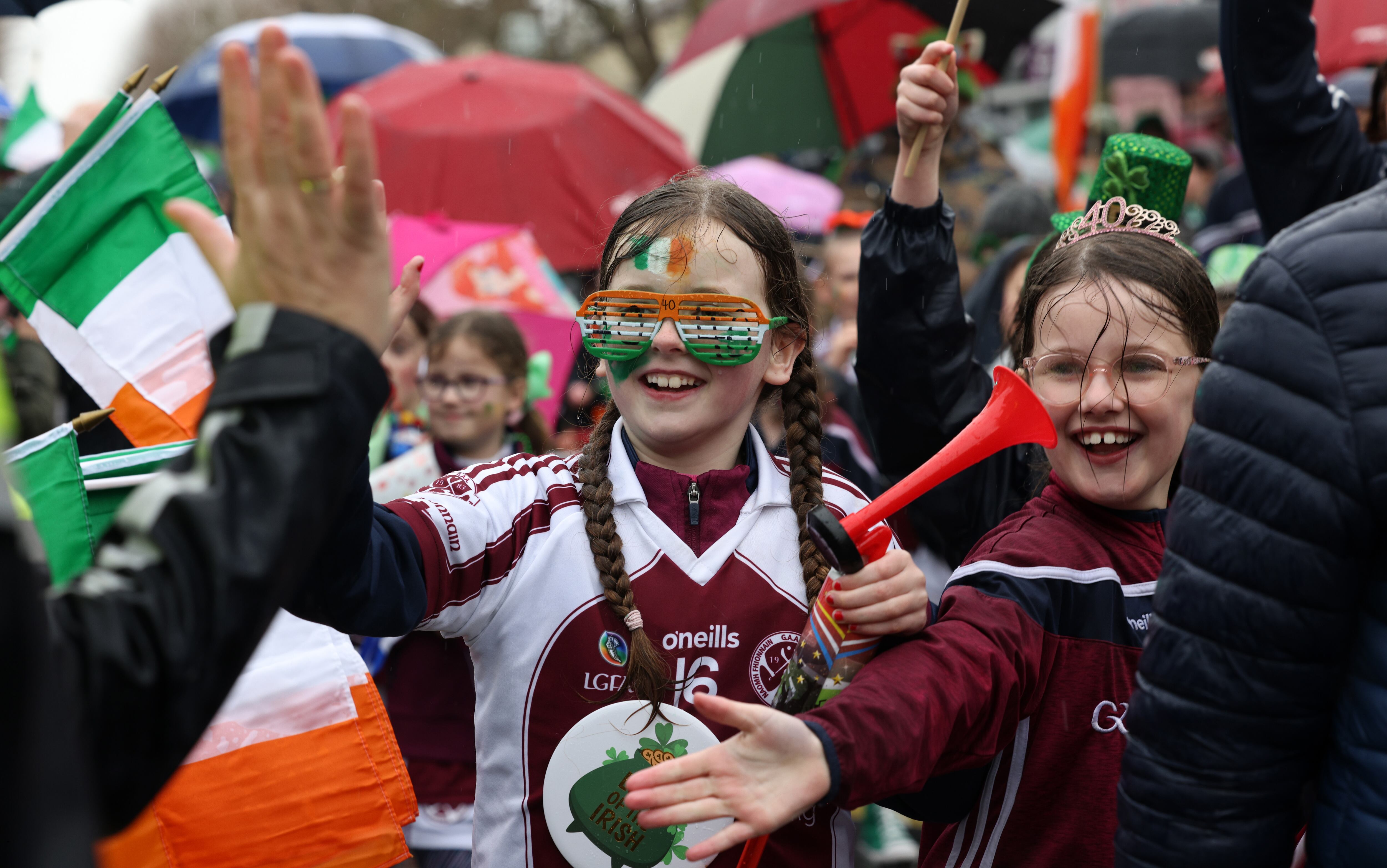 Members of St Finian's GAA club take part in the St Patrick's Day parade in Swords, Dublin. Photograph: Laura Hutton
