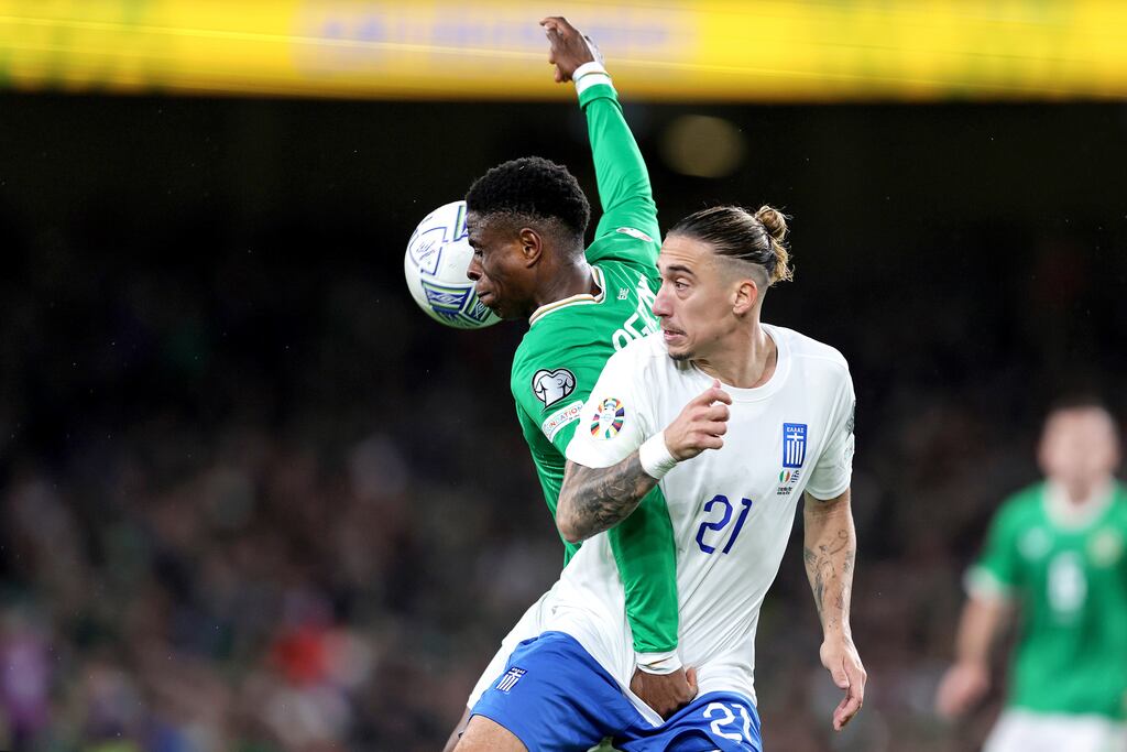 Ireland's Chiedozie Ogbene in action against Kostas Tsimikas of Greece at the Aviva Stadium. Photograph: Laszlo Geczo/Inpho