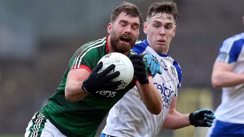 Aidan O’Shea is challenged by Monaghan’s Niall Kearns during Mayo’s win in Clones. Photograph: John McVitty/Inpho