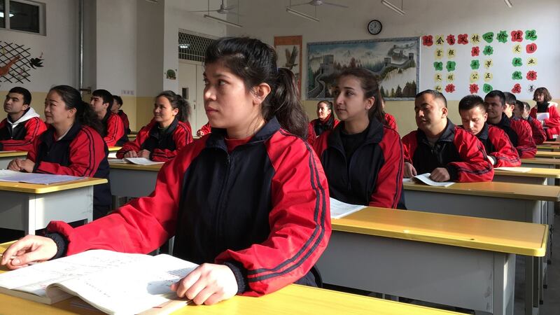 Residents at the Kashgar city vocational educational training centre attend a Chinese lesson during a government organised visit in Kashgar, Xinjiang, China. Photograph: Ben Blanchard/Reuters