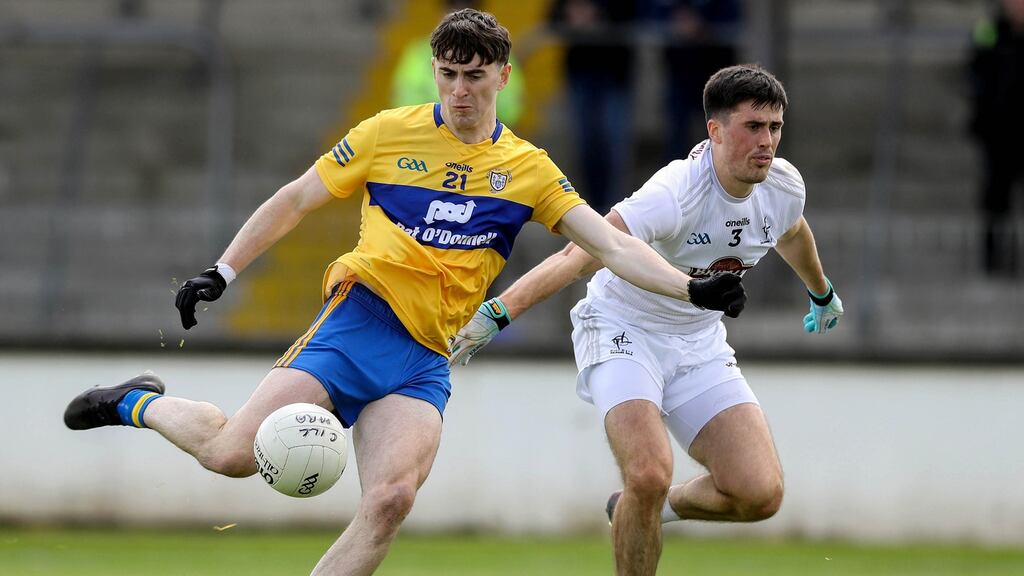 Clare’s Joe McGann scores despite Mick O’Grady of Kildare in their Allianz Football League clash. Photo: Lorraine O’Sullivan/Inpho