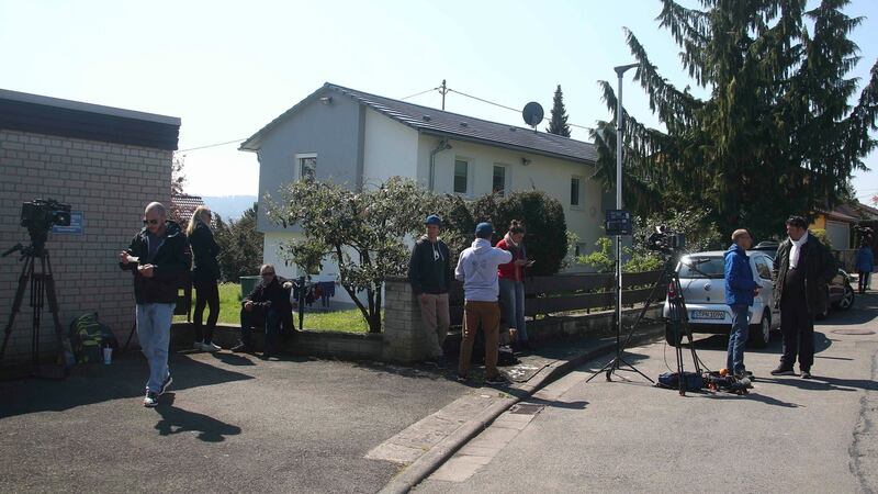 Media gather near a house were the German police arrested a suspect. Photograph: Michael Dalder/Reuters