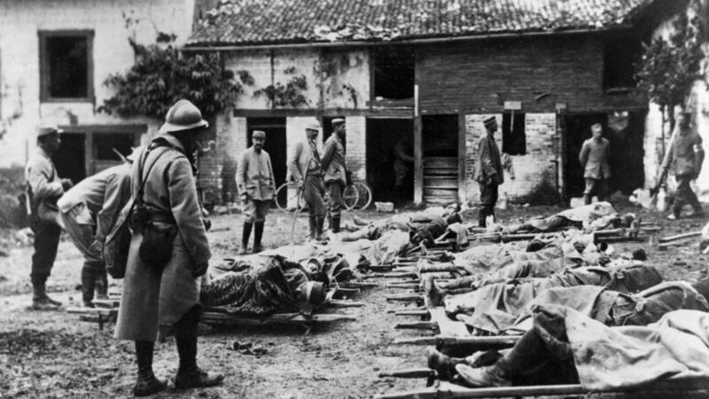 Wounded French troops in a farm after the Champagne Offensive during the Battle of Loos in France. Photograph: Hulton Archive/Getty Images