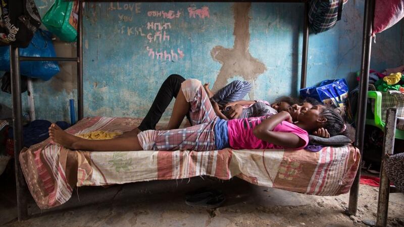 Eritrean girls chat on a bed in the unaccompanied minors section of Shagarab refugee camp, eastern Sudan. Photograph: Sally Hayden