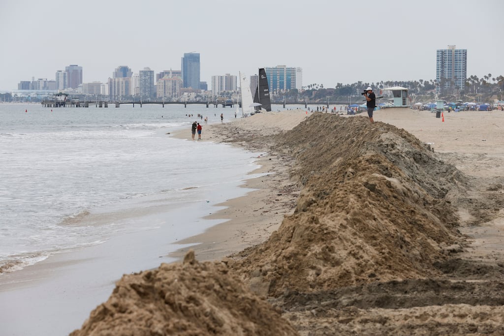 Sand banks line the beach in an effort to protect beachfront homes in Long Beach, California. Photograph: Caroline Brehman/EPA