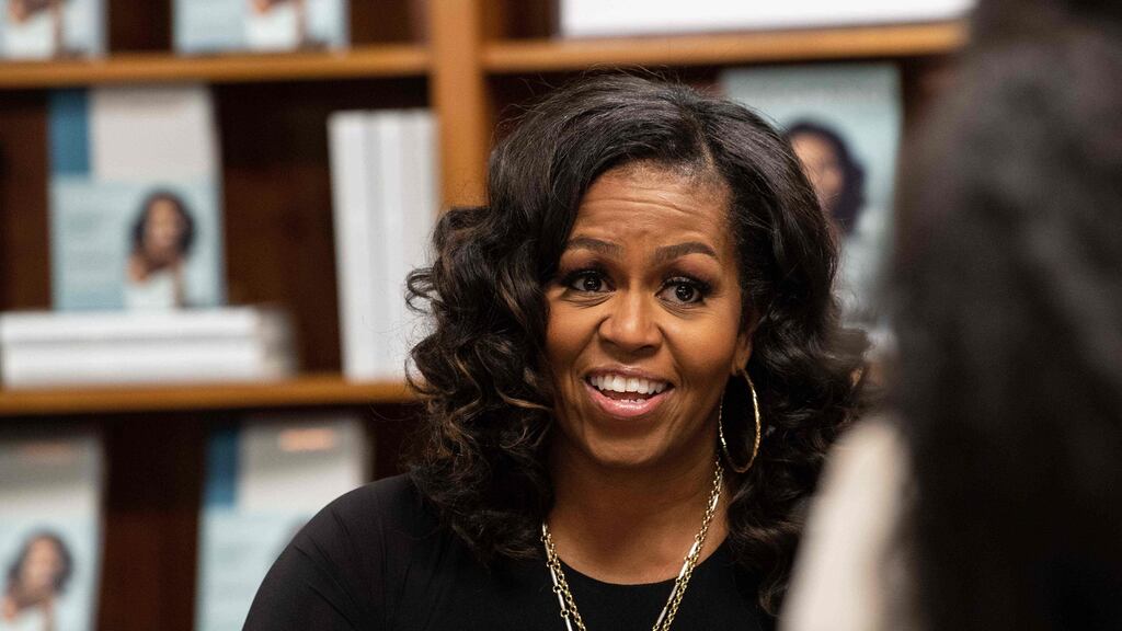 Former US first lady Michelle Obama meeting with fans during a book signing of her memoir Becoming in Washington. Photograph: Nicholas Kamm/AFP/Getty