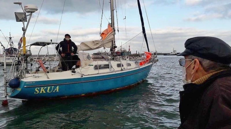 Carlos Alberto Ballestero visits his son Juan Manuel, who was barred from coming ashore for some 72 hours until he tested negative for coronavirus, after his arrival in Argentina having sailed from Portugal. Photograph: Juan Manuel Ballestero via New York Times