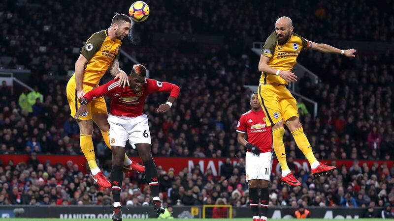 Brighton’s Shane Duffy heads the ball at Old Trafford. Photograph: Martin Rickett/PA Wire