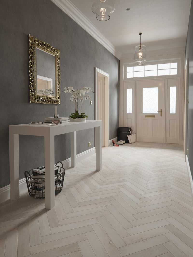 A pale and interesting high-end herringbone laminate in a hallway, €75 per sq m fitted. From Mulvey’s