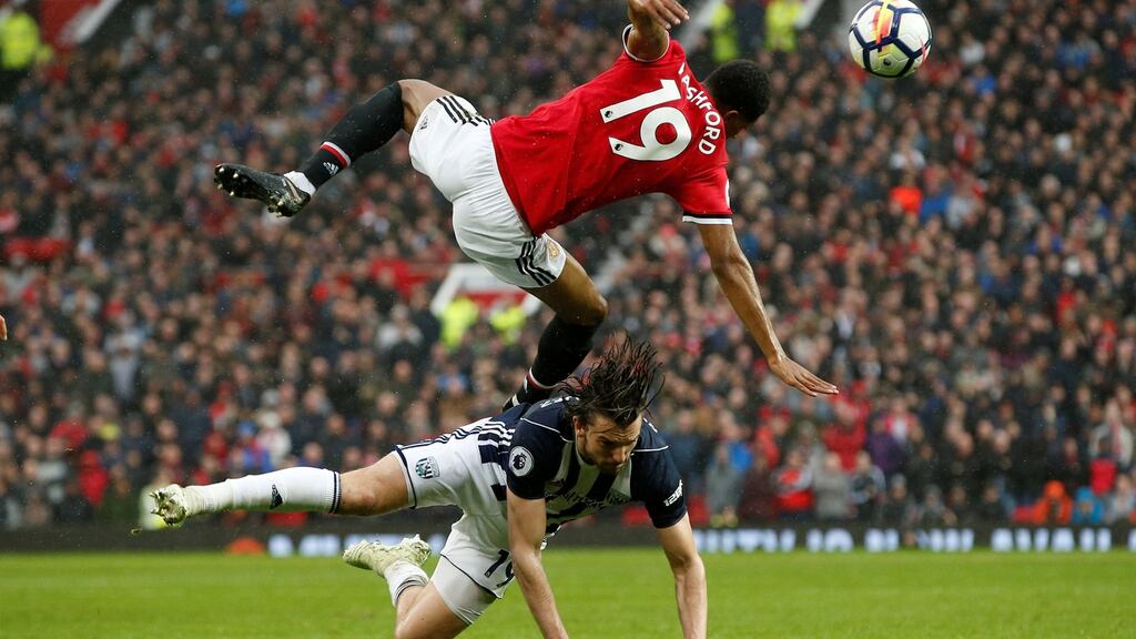 Manchester United’s Marcus Rashford and West Brom’s Jay Rodriguez in action at Old Trafford. Photograph: Reuters/Andrew Yates