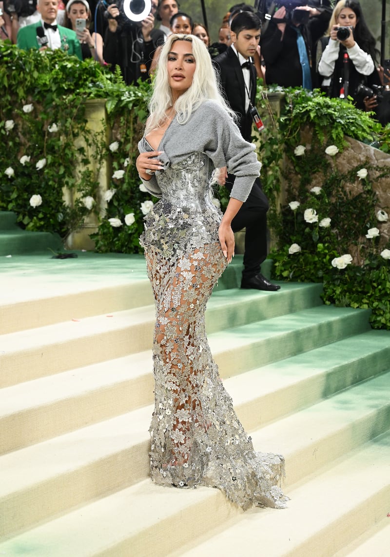 Kim Kardashian wore a custom floral-embellished corset skirt by Margiela and topped it off with a cardigan. Photograph: Gilbert Flores/Variety via Getty Images