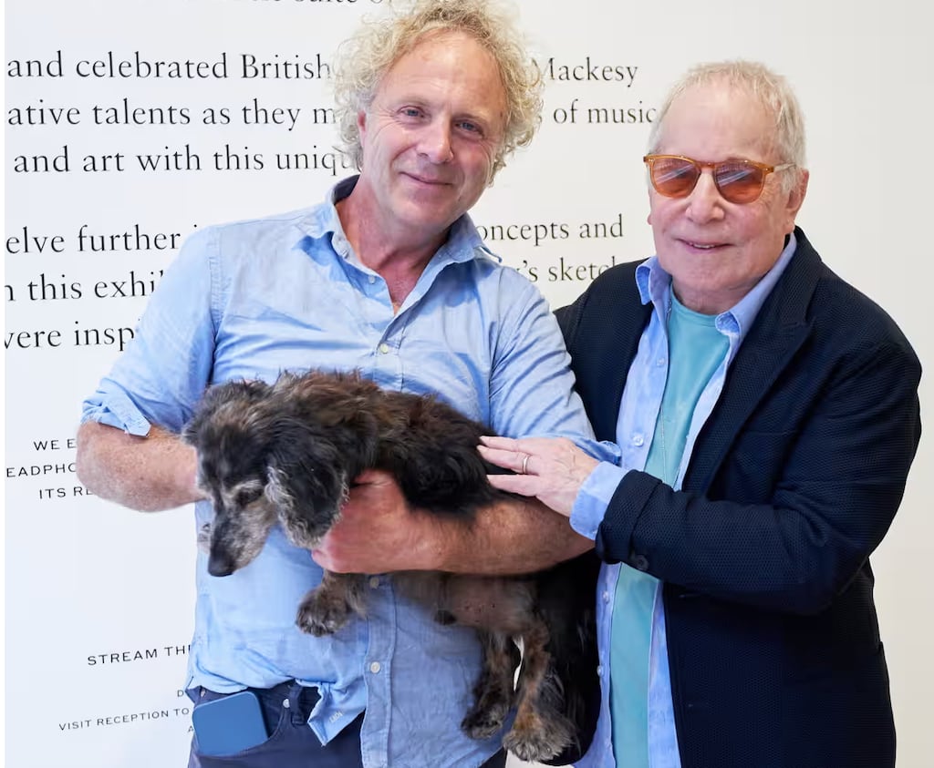 Paul Simon and artist Charlie Mackesy and his dog Barney at the launch in London of Seven Psalms, a series of warm atmospheric drawings by Mackesy inspired by listening to Paul Simon’s recent remarkable album of the same title