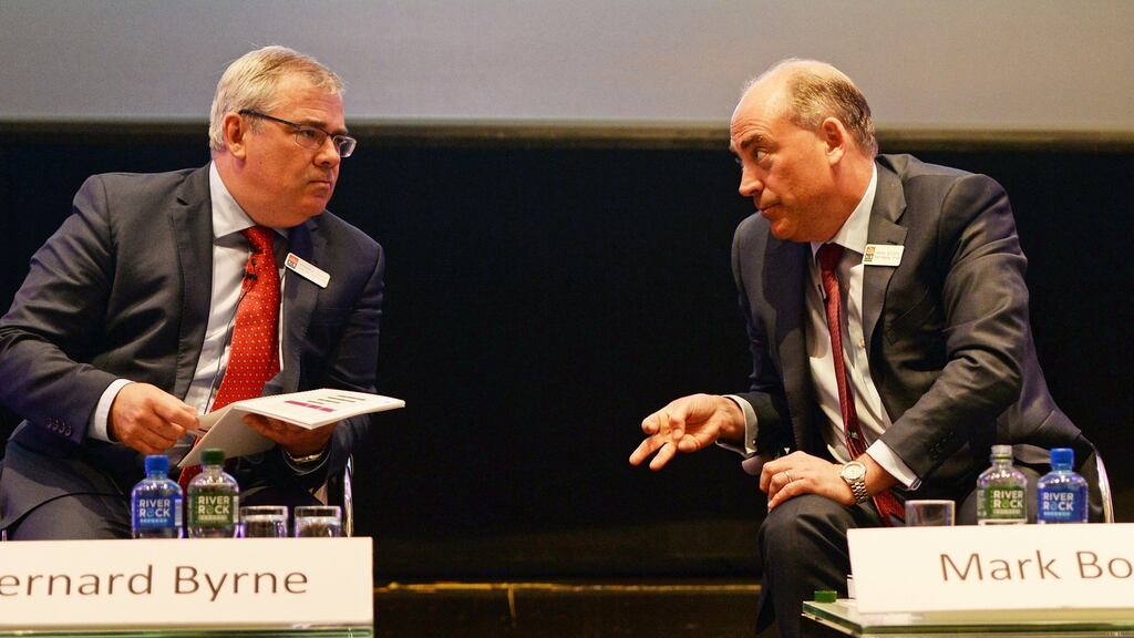 AIB chief executive Bernard Byrne and chief financial officer Mark Bourke: Speaking after the bank’s annual general meeting on Tuesday, Mr Byrne said AIB wasn’t coerced by Finance Minister Michael Noonan or other political forces when it announced a standard variable rate cut earlier this month. Photograph: Eric Luke/The Irish Times