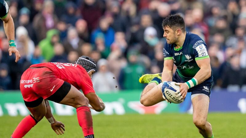 Connacht’s Tiernan O’Halloran with tries to evade Pita Ahki of Toulouse. Photo: Morgan Treacy/Inpho