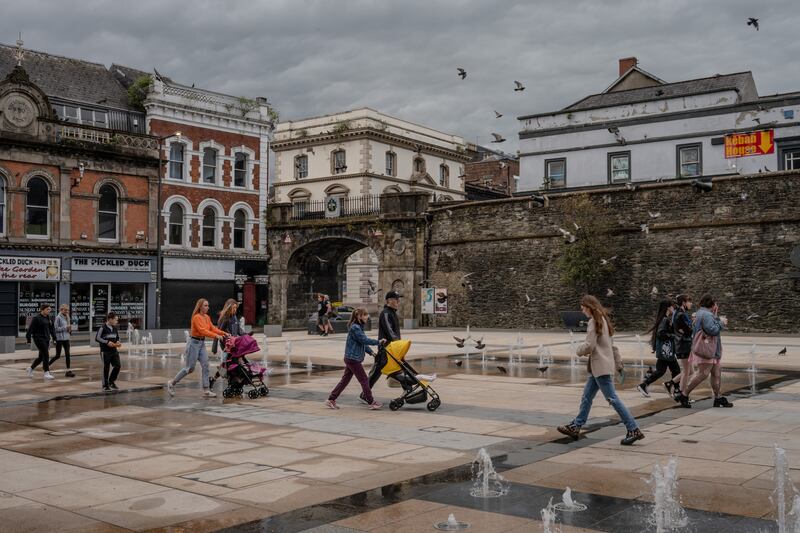 A square next to 17th-century stone walls in Derry. Photograph: Andrew Testa/New York Times