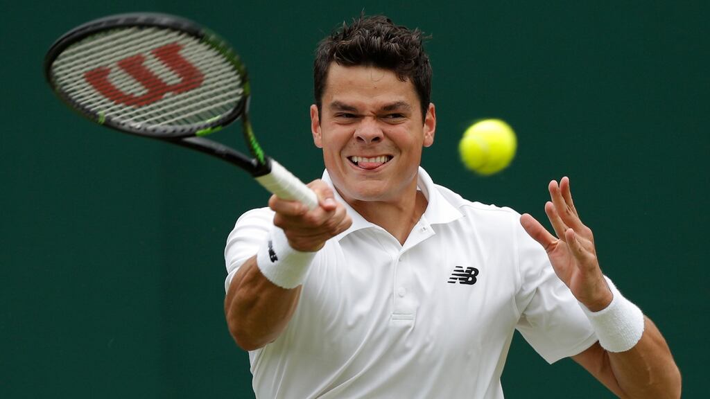 Canada’s Milos Raonic returns against Italy’s Andreas Seppi during their men’s singles second round match. Photo: Getty Images