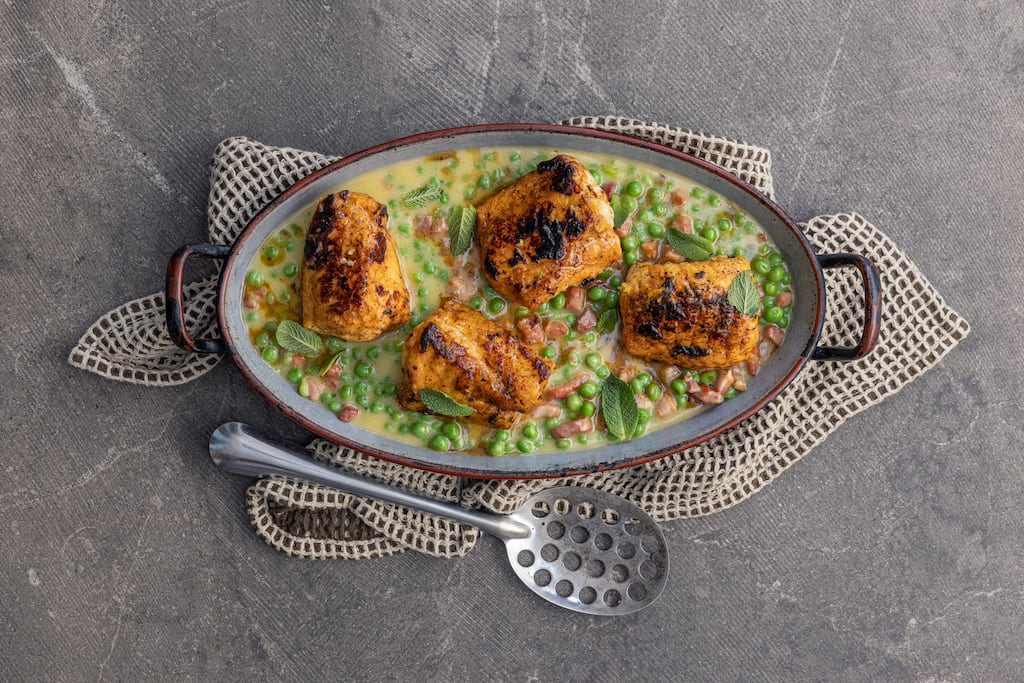Roast monkfish on the bone with fricassee of peas and bacon. Photograph: Harry Weir
