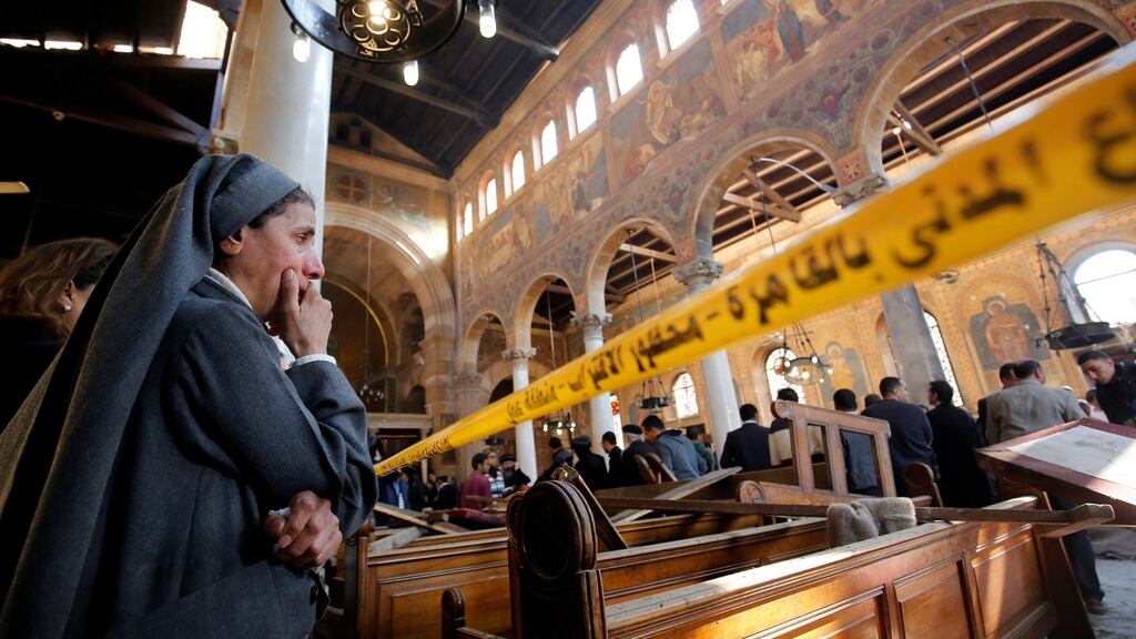 A nun cries as she stands at the scene inside Cairo’s Coptic cathedral, following the bombing. Photograph: Amr Abdallah Dalsh/Retuers