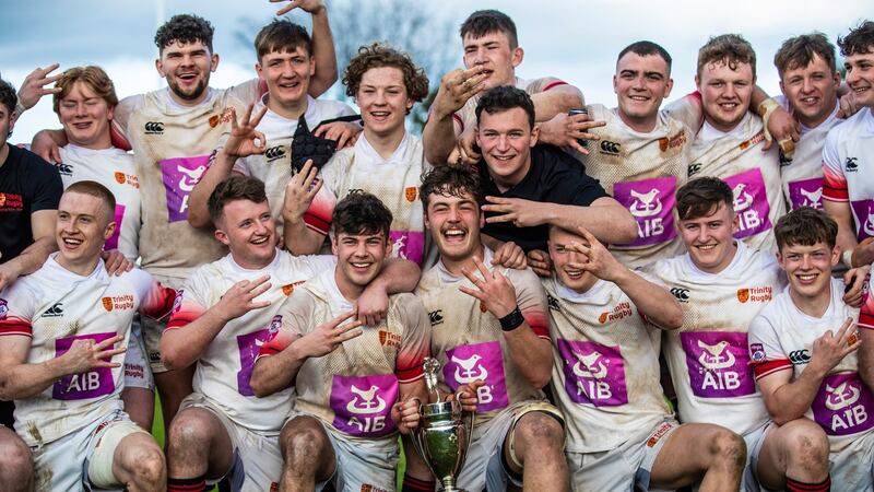 Dublin University celebrate winning the Fraser McMullan Cup. Photograph: Evan Treacy/Inpho