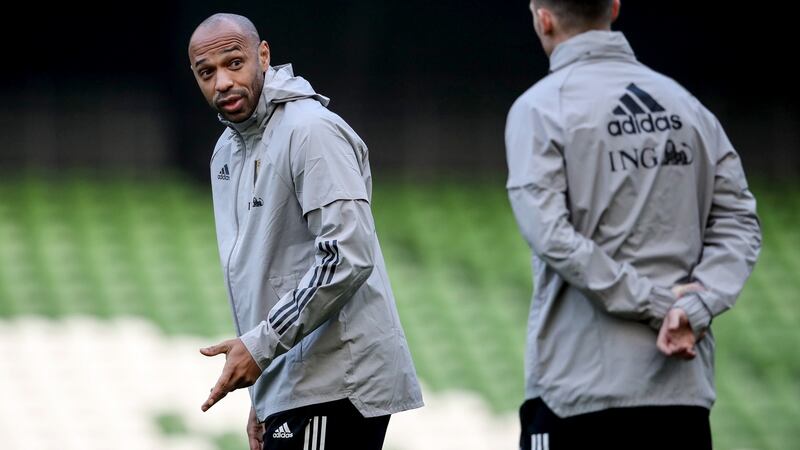 Belgium assistant coach Thierry Henry speaks to Anthony Barry during training. Photo: Evan Treacy/Inpho