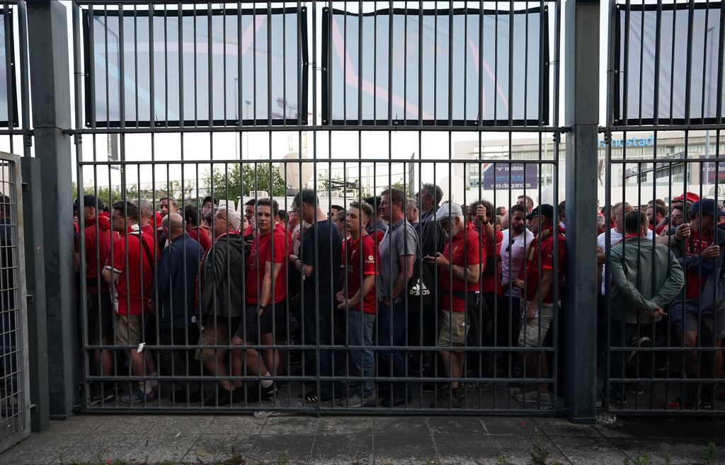 Fans waiting outside the gates to enter the stadium as kick-off is delayed before the UEFA Champions League final between Liverpool and Real Madrid at the Stade de France. Photograph: Nick Potts/PA Wire