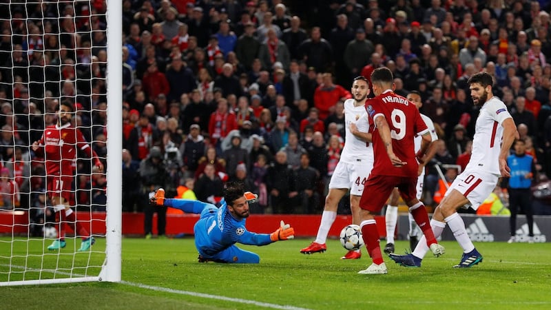 Roberto Firminio scores Liverpool’s fourth against AS Roma. Photograph: Phil Noble/Reuters