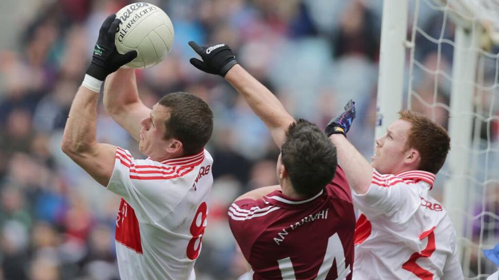 Derry’s Patsy Bradley claims the ball ahead of Westmeath’s Ciaran Curley during the Allianz Football League Division 2 Final at Croke Park. Photograph: Morgan Treacy/Inpho