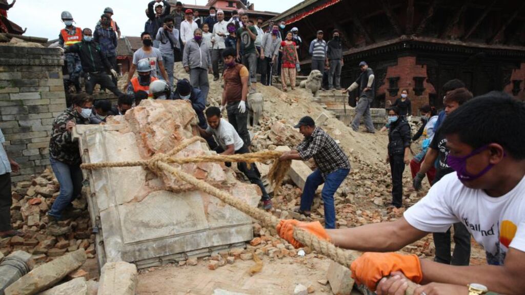 Rubble is removed from the ancient Mahadev Mandir temple at Durbar Square in Bhaktapur, Nepal. Photograph: EPA/Palani Mohan