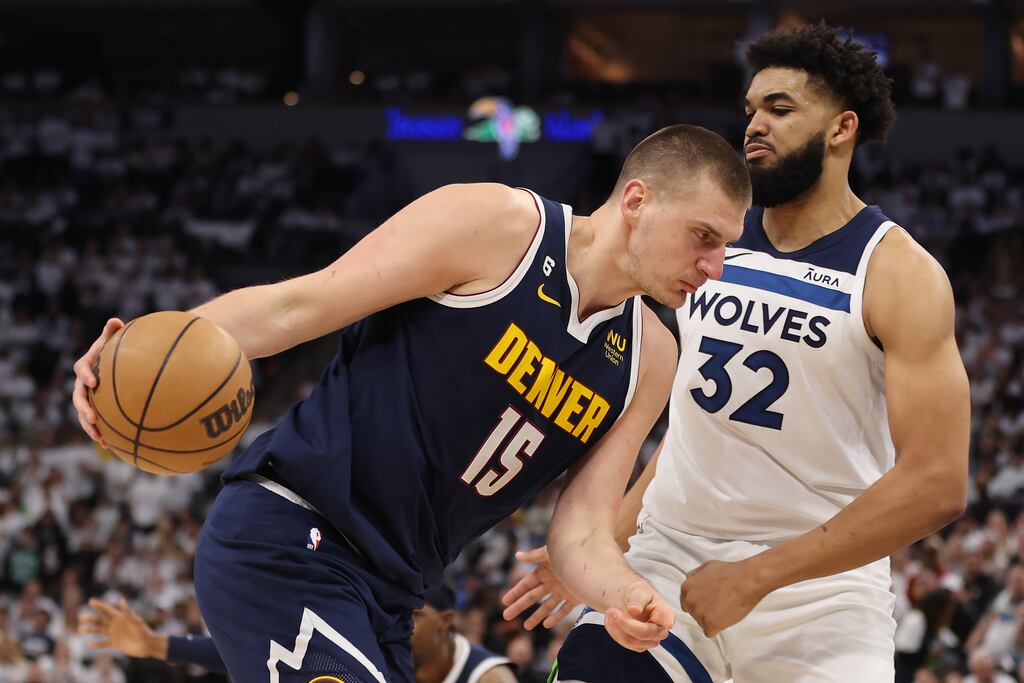 Nikola Jokic of the Denver Nuggets drives the ball against Karl-Anthony Towns. Photograph: Gregory Shamus/Getty